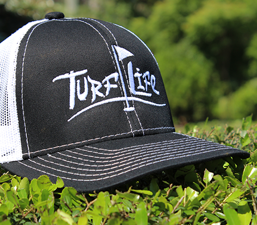 turf life finished product embroidery hat on grass